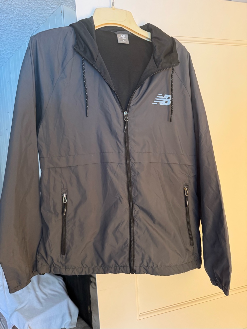 New Balance Men's Black Hooded Windbreaker with Reflective Logo